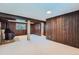 View of the finished basement space with a fireplace and wooden accents, offering a cozy retreat at 744 Memphis St, Aurora, CO 80011