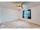 Bright bedroom with neutral carpet, ceiling fan, large window with curtains, and ample space for customization at 744 Memphis St, Aurora, CO 80011