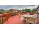 Outdoor deck features bright red planks and a dining set with neighborhood views at 744 Memphis St, Aurora, CO 80011