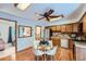 Eat-in kitchen features wooden cabinets and modern appliances, perfect for cooking and entertaining at 744 Memphis St, Aurora, CO 80011