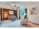Comfortable living room with wood paneled wall, perfect for cozy nights in at 744 Memphis St, Aurora, CO 80011
