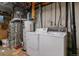 A functional basement with a washer and dryer, plus a modern furnace and water heater at 1531 S Owens St # 23, Denver, CO 80232