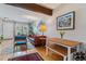 Inviting living room and dining area featuring hardwood floors and a colorful rug at 1531 S Owens St # 23, Denver, CO 80232