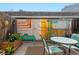 Charming outdoor patio with vibrant decor, perfect for relaxing or entertaining guests at 1531 S Owens St # 23, Denver, CO 80232