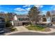 Beautiful home with mature trees, well-maintained lawn, a two-car garage, and a welcoming curb appeal at 10200 Julian St, Westminster, CO 80031