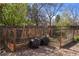 Well-maintained backyard with a garden, planter, and mature trees and landscaping at 10200 Julian St, Westminster, CO 80031