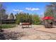 Spacious backyard featuring an outdoor dining area, built-in barbecue, and mature landscaping at 10200 Julian St, Westminster, CO 80031