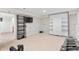 Spacious basement area featuring a wall mounted TV and a murphy bed, perfect for recreation or hobbies at 10200 Julian St, Westminster, CO 80031