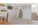 Basement room with stairs, and a partially visible bathroom, offering extra living space at 10200 Julian St, Westminster, CO 80031