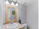 Neutral bathroom with vanity, mirror, and fixtures at 10200 Julian St, Westminster, CO 80031