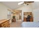 Bedroom features natural light, a desk, and an ensuite bathroom at 10200 Julian St, Westminster, CO 80031