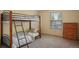 Bedroom with neutral carpet, natural light and bunk bed at 10200 Julian St, Westminster, CO 80031