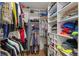 Large walk-in closet features built-in shelving and hanging storage at 10200 Julian St, Westminster, CO 80031