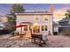 Exterior view of the house showing the backyard with solar panels, barbecue, and outdoor dining area at 10200 Julian St, Westminster, CO 80031