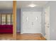 Bright foyer with hardwood floors, a double front door, and a glimpse into the living space at 10200 Julian St, Westminster, CO 80031