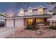 Charming two-story home with a two-car garage and inviting front porch, blending traditional design with modern comfort at 10200 Julian St, Westminster, CO 80031