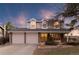 Charming two-story home with a two-car garage and inviting front porch, blending traditional design with modern comfort at 10200 Julian St, Westminster, CO 80031