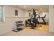 Home gym with weight equipment and wood floor at 10200 Julian St, Westminster, CO 80031