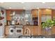 Bright kitchen features stainless steel appliances, granite countertops, and light wood cabinetry at 10200 Julian St, Westminster, CO 80031