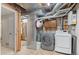 Functional basement laundry area with modern washer and dryer appliances, and exposed duct work and plumbing at 10200 Julian St, Westminster, CO 80031