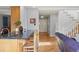 Spacious living room connects to kitchen, features wood floors, and natural light at 10200 Julian St, Westminster, CO 80031