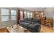 Cozy living room with natural light, hardwood floors, and direct access to the kitchen at 10200 Julian St, Westminster, CO 80031