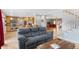 Comfortable living room connecting the kitchen to the home's staircase at 10200 Julian St, Westminster, CO 80031