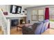 Cozy living room features a fireplace, built-in bookshelves, and access to the backyard at 10200 Julian St, Westminster, CO 80031