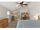 Angled ceiling main bedroom with a large desk area and attached bathroom for convenience at 10200 Julian St, Westminster, CO 80031