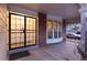Inviting home entrance with secure iron gate, brick accents, and a bay window for a warm, welcoming appeal at 10200 Julian St, Westminster, CO 80031