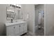 Clean bathroom with a white vanity and hexagonal tile floor at 290 Glencoe St, Denver, CO 80220