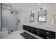 Modern bathroom with double vanity, marble counters, and large shower at 290 Glencoe St, Denver, CO 80220