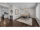 Dining room with a wooden table, chandelier, and built-in cabinetry at 290 Glencoe St, Denver, CO 80220