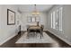 Formal dining room with hardwood floors and a large chandelier at 290 Glencoe St, Denver, CO 80220