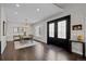 Bright dining room with hardwood floors and view into living room at 290 Glencoe St, Denver, CO 80220