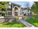 Exterior of a two-story house with landscaping and a walkway at 290 Glencoe St, Denver, CO 80220