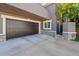 Attached garage with dark brown doors and ample space at 290 Glencoe St, Denver, CO 80220