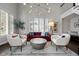 Living room with comfortable seating, a coffee table, and large windows at 290 Glencoe St, Denver, CO 80220