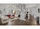 Living room with hardwood floors, a fireplace, and modern furniture at 290 Glencoe St, Denver, CO 80220