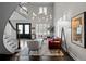 Living area with hardwood floors, a chandelier, and comfortable seating at 290 Glencoe St, Denver, CO 80220