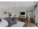 Main bedroom with hardwood floors and access to other rooms at 290 Glencoe St, Denver, CO 80220