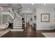 Elegant curved staircase with dark wood and white railings at 290 Glencoe St, Denver, CO 80220