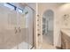 Modern bathroom with glass-enclosed shower and seamless connection to the rest of the primary suite at 8220 Lamar Cir, Arvada, CO 80003
