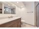 Modern bathroom with double sink vanity, and a glass-enclosed shower offering a luxurious space at 8220 Lamar Cir, Arvada, CO 80003