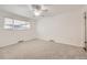 Bright bedroom featuring neutral carpeting and a ceiling fan for year round comfort at 8220 Lamar Cir, Arvada, CO 80003