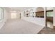Bright open living room with new carpet and distinctive arched details at 8220 Lamar Cir, Arvada, CO 80003