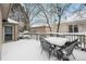 Snow covered deck furniture on back patio at 7329 Windsor Dr, Boulder, CO 80301