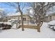 Backyard deck with snowy landscaping at 7329 Windsor Dr, Boulder, CO 80301