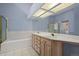 Elegant bathroom with double sinks and a large mirror at 7329 Windsor Dr, Boulder, CO 80301