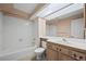 Clean bathroom with tub, toilet and vanity at 7329 Windsor Dr, Boulder, CO 80301